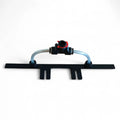 Black plastic drip irrigation emitter with transparent tubing and red valve for Gardiner Spül-Leiste rinsebar system