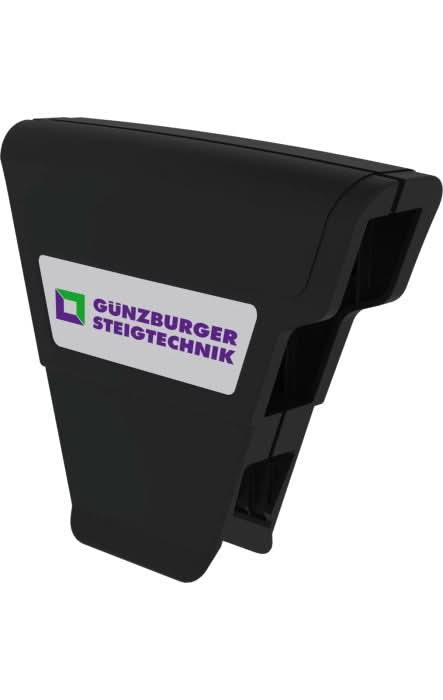 Schwarze kunststoffklemme mit weißem etikett und günzburger steigtechnik logo im münk ergo-pad griffzone produkt