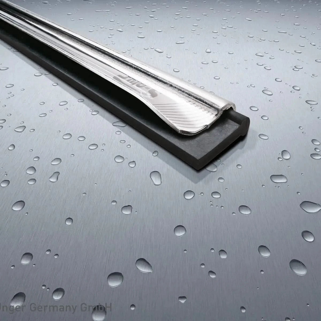 Shiny chrome chrome-plated metal door sill protector with black rubber base from unger s-schiene plus