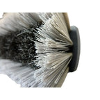 Nahaufnahme der unger nLITE power bürste komplett ungesplissen grau mit schwarzem griff und weißen borsten und grauer abrasive